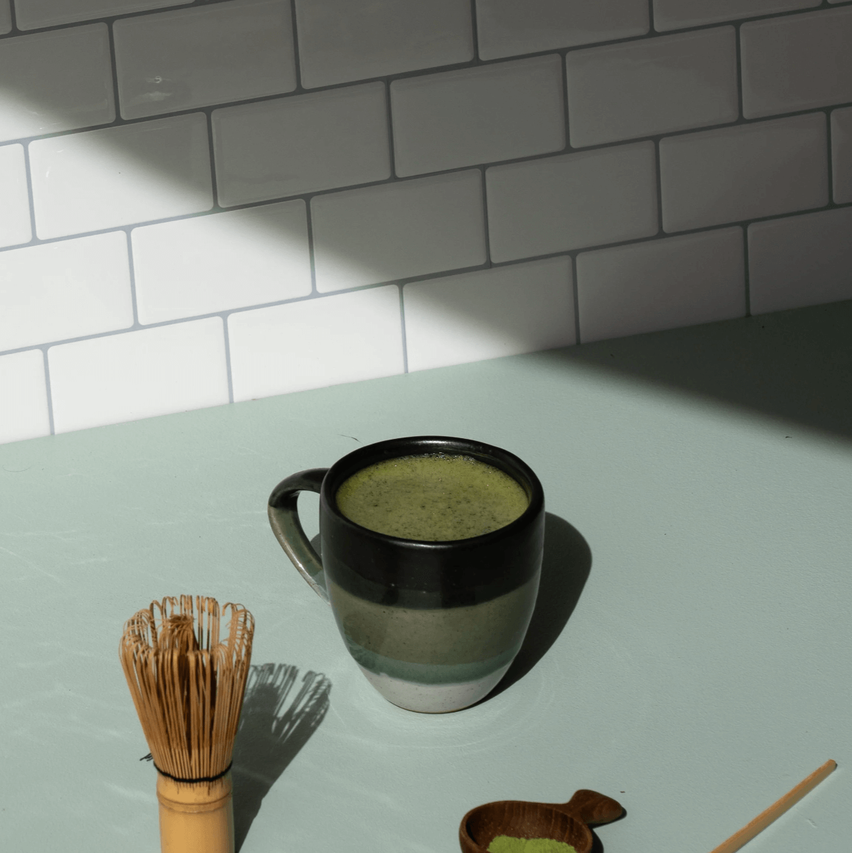 Cymbiotika Organic Matcha in a mug