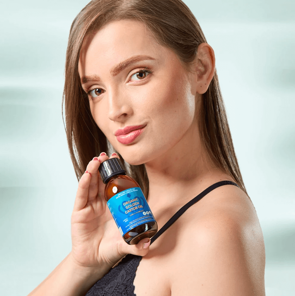 Image of woman holding organic castor oil